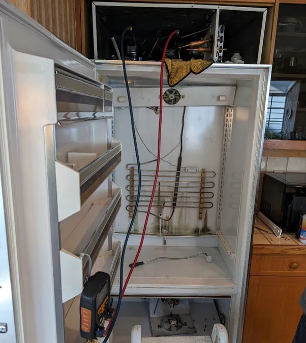 46-year-old Sub-Zero built-in refrigerator during a full sealed-system rebuild